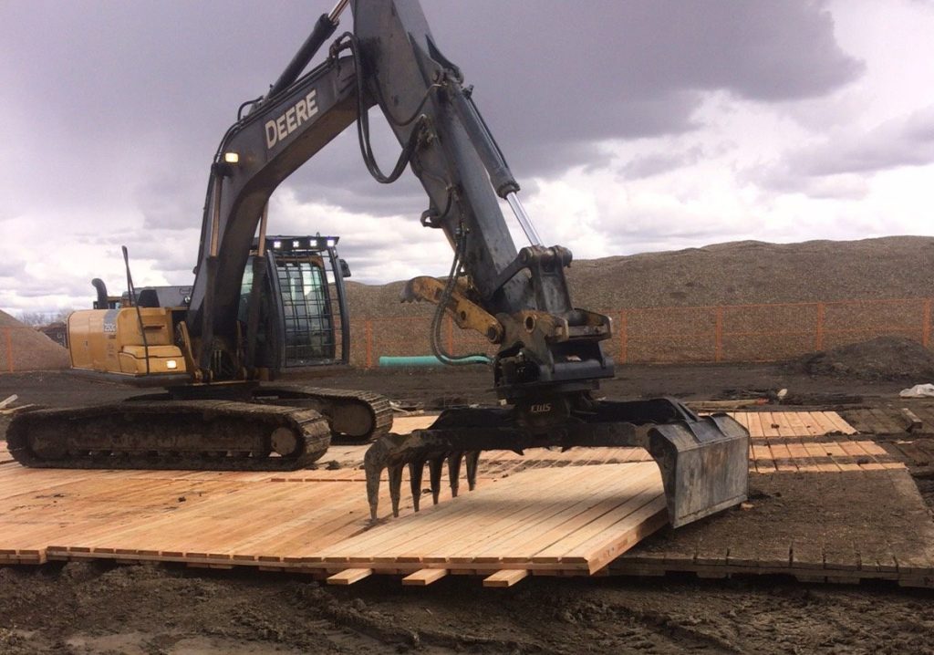 access mat being installed at a construction site in BC